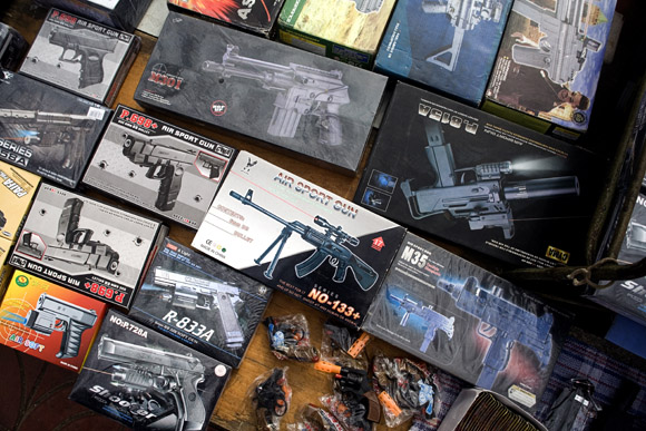 Toy guns are for sale at a Lunar New Year market in Pukou near Nanjing, Jiangsu, China.
