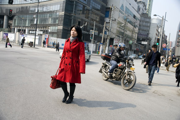People cross the streets of the Bund area in Shanghai, China.