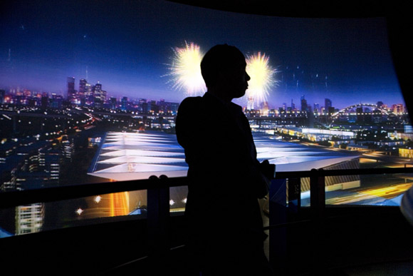 A man watches a panoramic video about the future of Shanghai inside the Shanghai Urban Planning Museum in Shanghai, China.