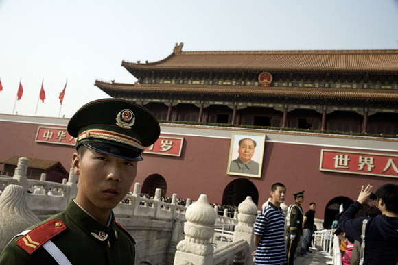 Tourists stream into the Tiananmen Gate of the Forbidden City compound in Beijing, China.