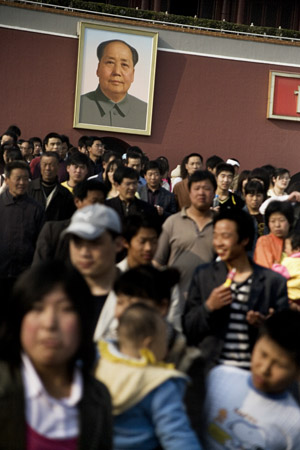 Tourists stream out of the Tiananmen Gate of the Forbidden City compound in Beijing, China.