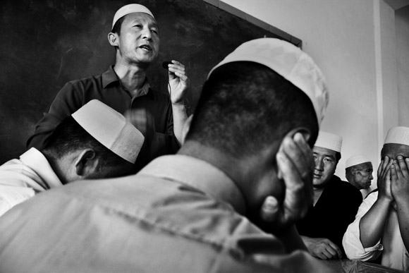 An imam speaks at a small mosque in Pingliang, Gansu, China. An imam speaks at a small mosque in Pingliang, Gansu, China.