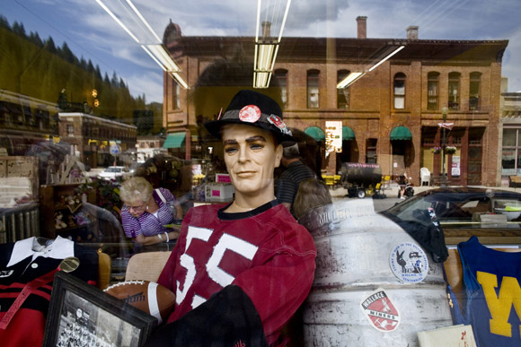Highschool sports memorabilia fills a window display in Wallace, Idaho, USA.