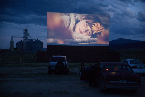 A trailer for Where the Wild Things are is displayed on a drive-in movie theater screen in Butte, Montana, USA.