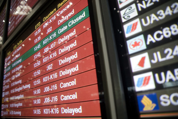 A flight information board displays caanceled and delayed flights at Beijing Capitol Airport Terminal 3 in Beijing, China. Almost all departures and many arrivals were severely delayed or canceled due to thunderstorms and hail in the area.