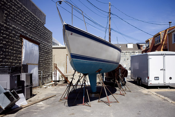 Sailboats stand above ground in dry dock at Newport, Rhode Island, USA.