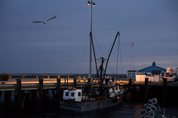 Fishing boats float at docks in Provincetown, Massachusetts, USA.